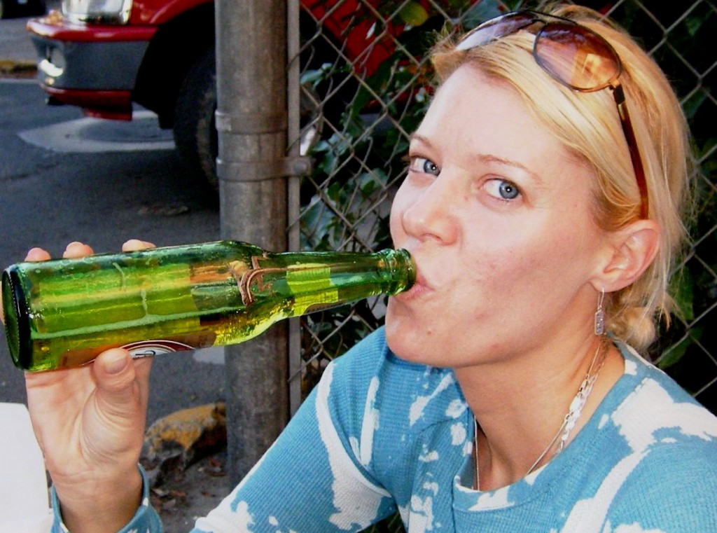 A thirsty Anolis cristatellus checks out Candee's El Presidente at Cruz Bay.